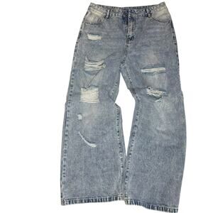Distressed blue Denim jeans with a baggy fit. Size XL